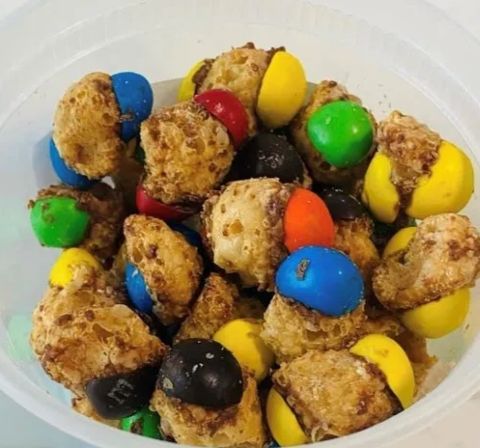 Freeze-dried Caramel M&M stardust clusters in a resealable candy bag. Light, crunchy texture.