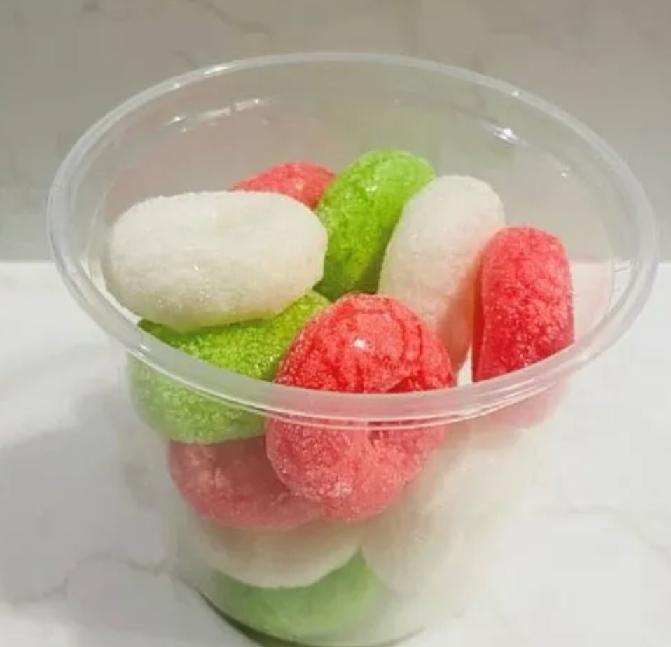 Freeze-dried Christmas gummy wreaths puffed into crunchy holiday snack pieces in a resealable bag.